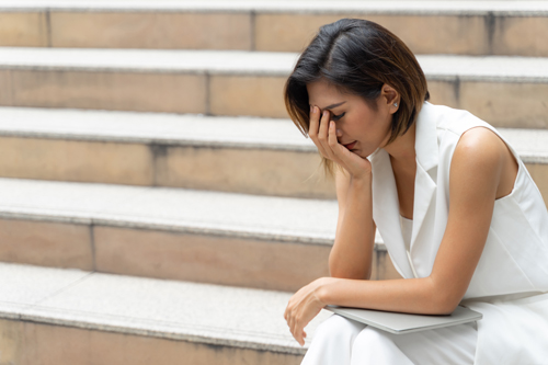 Sadness young woman crying on the stair